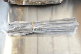 Bundle of stainless steel knives wrapped in plastic with "Choice" branding, new condition.