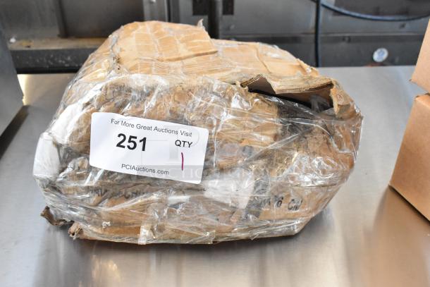 Damaged cardboard package wrapped in plastic with auction label "251" from PCIAuctions.com, indicating quantity "1".