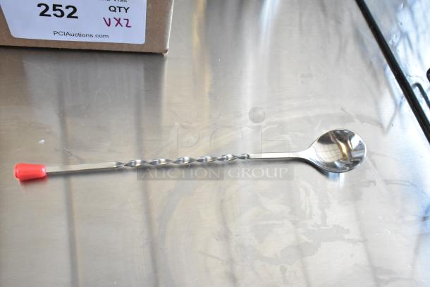 Stainless steel twisted bar spoon with red cap, excellent condition. Auction tag marked 252, website PCI Auctions visible.