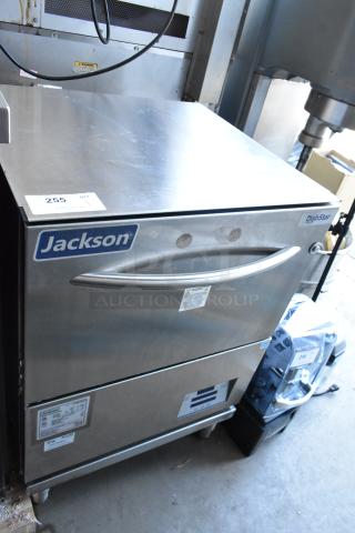 Jackson DishStar commercial dishwasher, stainless steel finish, model number visible, used condition, with product label and warning stickers.