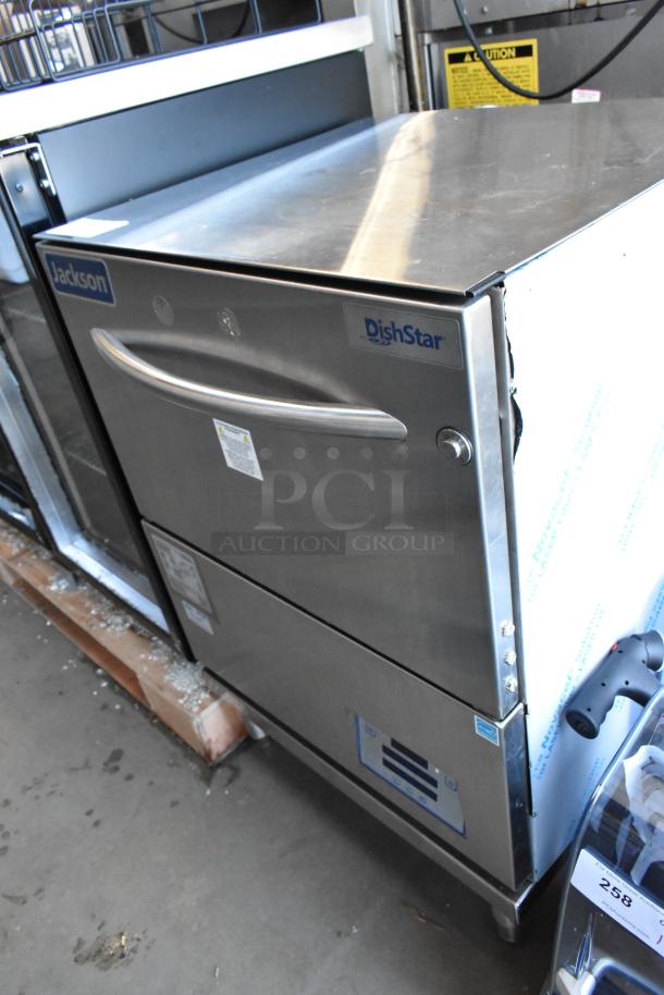Stainless steel Jackson DishStar commercial dishwasher, pristine condition, visible brand logo, and operational labels.