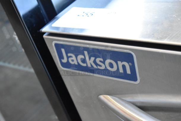 Jackson stainless steel dishwasher. Visible commercial kitchen appliance label. Auction item number 255.