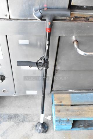 DoctorRoo black walking cane with LED handle, wrist strap, and rubber tip. Appears in good condition.