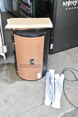 Backyard Pro charcoal smoker in brown, new condition, with assembly parts in packaging. Label reads "Backyard Pro."