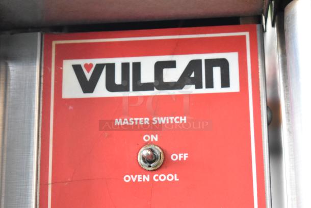 Vulcan oven control panel with master switch, featuring options for On, Off, and Oven Cool in working condition.