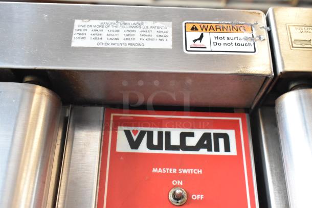 Vulcan appliance control panel with master switch, patent details, and hot surface warning label. Signs of wear present.