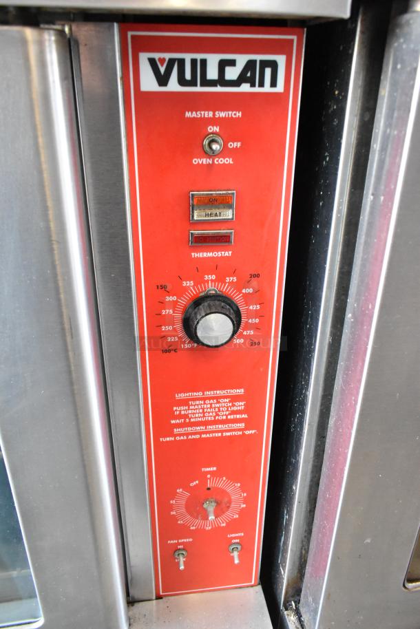 Vulcan commercial oven control panel, red with branding. Features thermostat, master switch, and lighting instructions visible.
