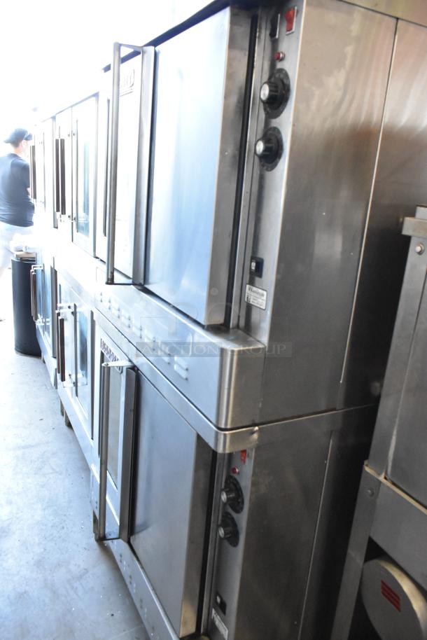 Commercial stainless steel oven stack with control knobs, labeled "Vulcan," in used condition. Multiple units visible.