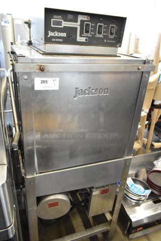 Jackson 200 Series commercial dishwasher. Stainless steel, control panel with power/status buttons. Good condition. Lot tag 265.