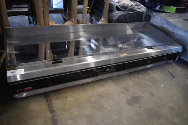 Commercial stainless steel flat-top griddle with multiple burners, good condition, auction label 266 visible.