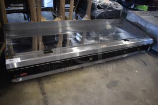 Commercial stainless steel flat-top griddle with multiple burners, good condition, auction label 266 visible.