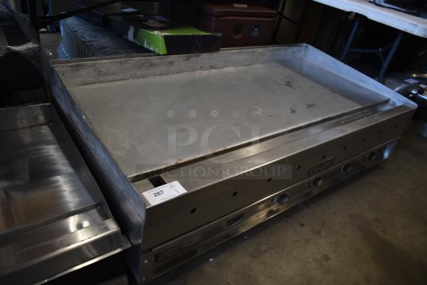 Vulcan commercial griddle in fair condition, stainless steel, adjustable knobs, auction lot 267 tag visible.