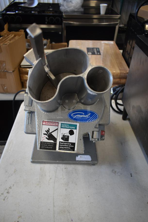 General Slicing commercial food processor, metal construction, safety labels, on/off switch, used condition.