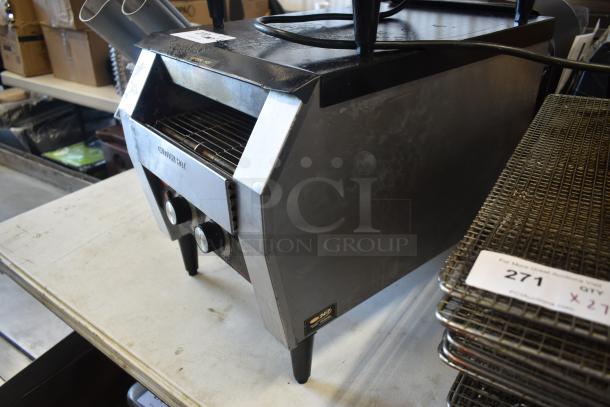Commercial conveyor toaster with dual dials, stainless steel finish, and visible wear. Marked “Caution Hot.” Model label present.