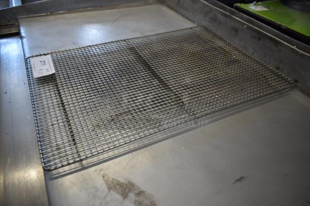 Metal cooling rack in used condition, labelled with lot number 271, featuring a grid pattern on a stainless steel surface.