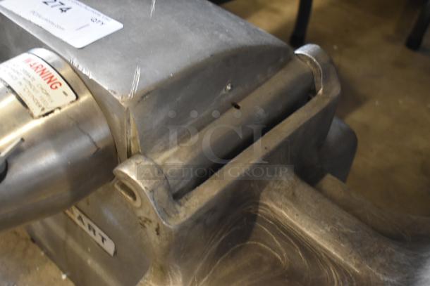 Industrial metal component with visible surface wear, warning label, and auction tag marked "274." Constructed from sturdy material.