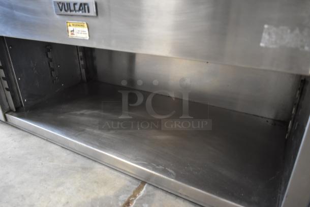 Commercial Vulcan stainless steel warming drawer, includes visible warning label, in used condition.