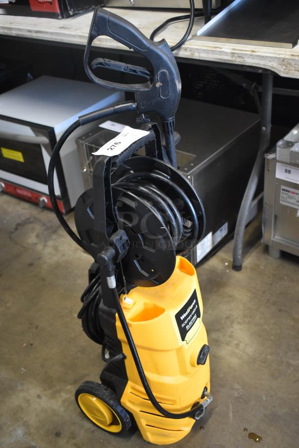 Yellow power washer with hose reel and wheels, labeled "WestForce," tag reads "276." Used condition.
