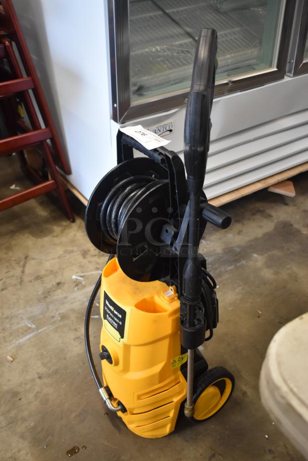Yellow Westforce pressure washer, with hose reel and handle. Item tag "276", label displays model details. Good condition.