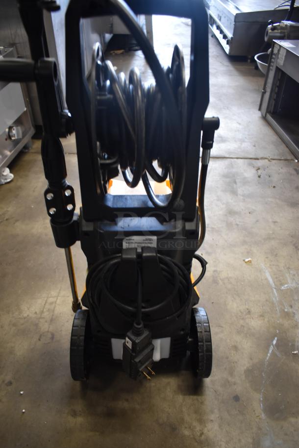 Electric pressure washer on wheels, black coil hose, and plug shown. Model label indicates it is in good condition.