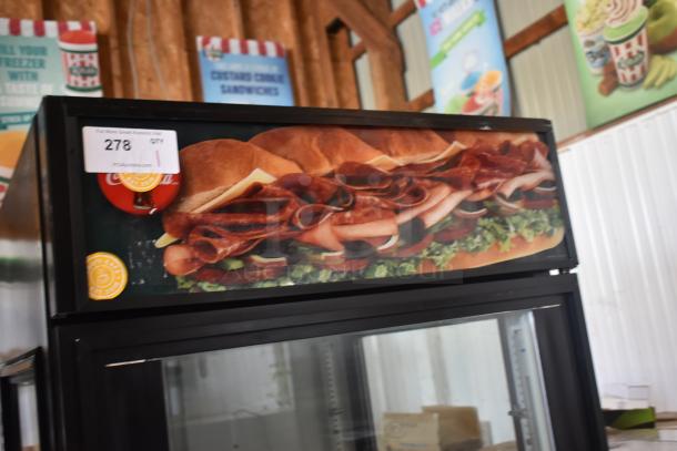 Commercial refrigerated display case with sandwich graphic, auction tag reads "278". Used condition, ideal for deli or cafe.