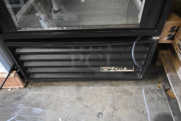 True commercial cooler vent, black with visible brand label. Used condition with minor wear. Ideal for retail display.