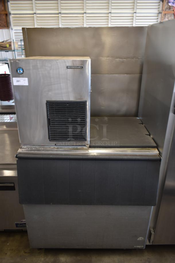 Hoshizaki ice maker with model label, stainless steel exterior, in used condition. Lot tag indicates item number 281.
