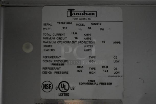 Traulsen commercial freezer label; Model G22010, 115 volts, refrigerant 404A, design pressure 370/174, NSF and UL listed.