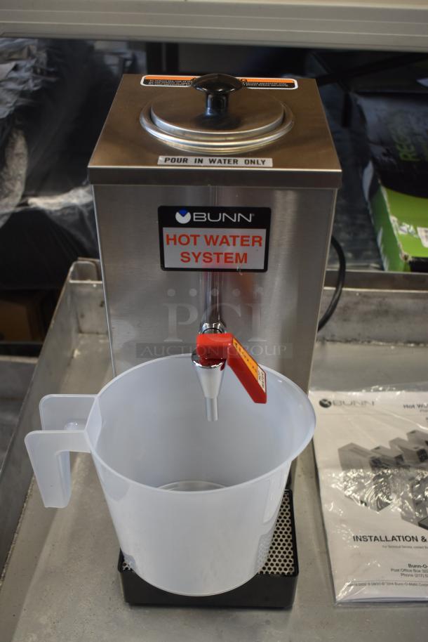 Bunn hot water system with manual spout, labeled "Pour In Water Only", includes plastic pitcher, excellent condition.
