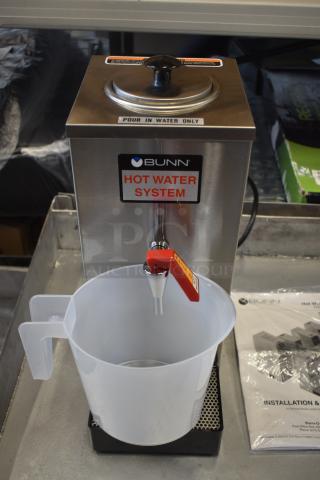 Bunn hot water system with manual spout, labeled "Pour In Water Only", includes plastic pitcher, excellent condition.