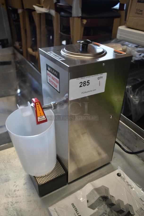 Bunn hot water system with spout, stainless steel, labeled "Hot Water System," auction tag 285, includes manual. Excellent condition.