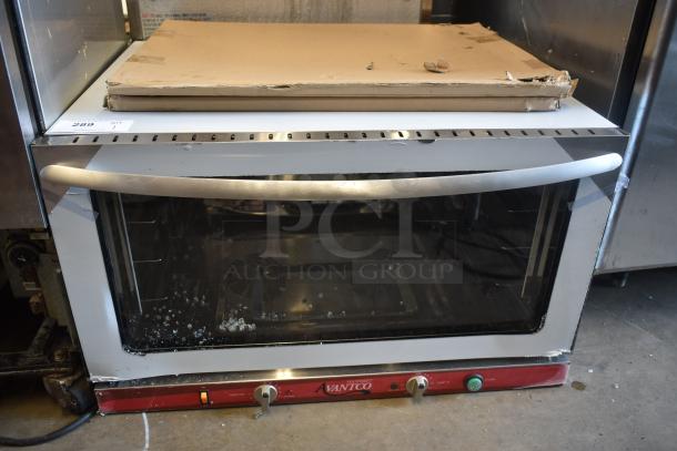 Avantco commercial convection oven, silver, some surface wear, visible control knobs. Auction tag 289 in top left.