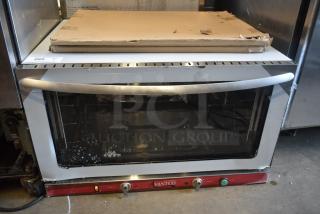 Avantco commercial convection oven, silver, some surface wear, visible control knobs. Auction tag 289 in top left.