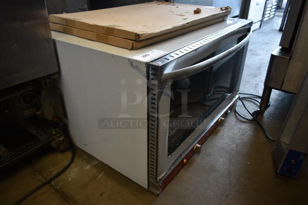 Industrial countertop oven with metallic finish, glass door, sturdy handle, visible wear. Label reads "280" for auction.
