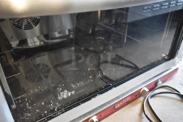 Avantco commercial convection oven with glass front, visible scuffs and debris inside, power cord attached, fair condition.
