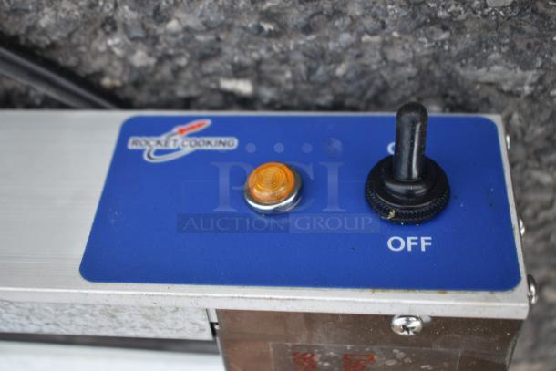 Rocket Cooking power switch panel with orange indicator light and toggle switch, labeled "OFF."