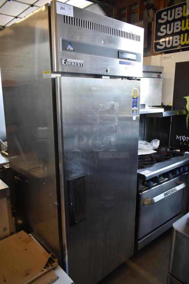 Everest stainless steel commercial refrigerator, single-door, visible wear on door, model tag indicates durability.