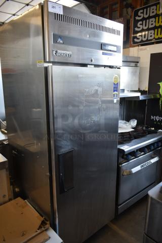 Everest stainless steel commercial refrigerator, single-door, visible wear on door, model tag indicates durability.