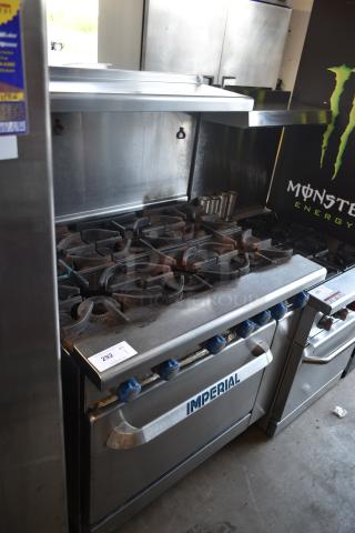 Imperial commercial gas range with six burners, stainless steel, used condition, auction tag 292 visible.