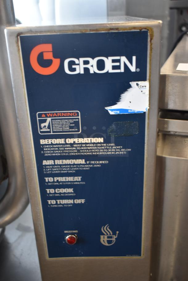 Groen industrial kettle control panel, model unknown, with operational instructions and warning label. Some wear on panel.