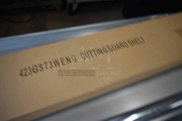 Cardboard box labeled "423GSTSWENG Cutting Board Shelf," unopened.