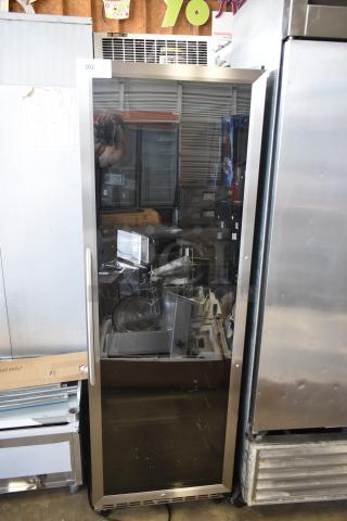 Commercial glass door refrigerator with stainless steel frame. Visible inspection tag number 302. Used condition.