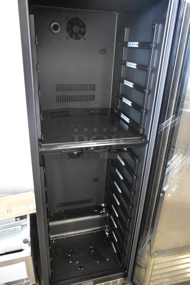 Black server rack cabinet with ventilation fans, adjustable shelves, and power strip, showing signs of minor wear.