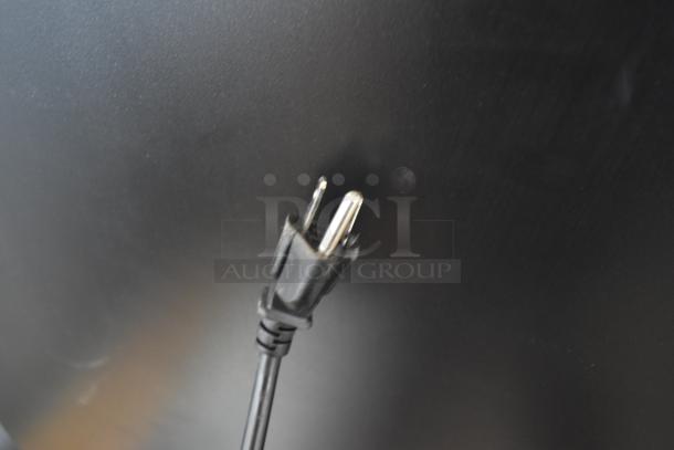 Power cord with two-prong plug, black, in good condition, no visible damage. Suitable for general electrical appliances.