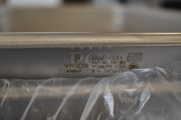Vigor stainless steel pan, made in USA, model P/N 2471822. Features patent no. D817069. New condition, partially wrapped.