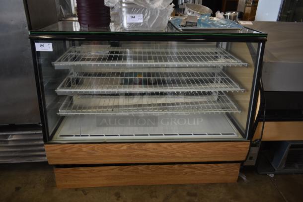 Glass-front refrigerated display case with four wire shelves, wooden base, and glass top. Auction tag "305" visible.