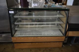 Glass-front refrigerated display case with four wire shelves, wooden base, and glass top. Auction tag "305" visible.