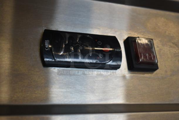 Control panel with Carel branding on stainless steel appliance. Features power and function buttons. Used condition.