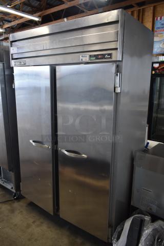 Beverage-Air commercial stainless steel two-door refrigerator, model ER74, in good condition. Visible labels indicate thermostat controls and model.