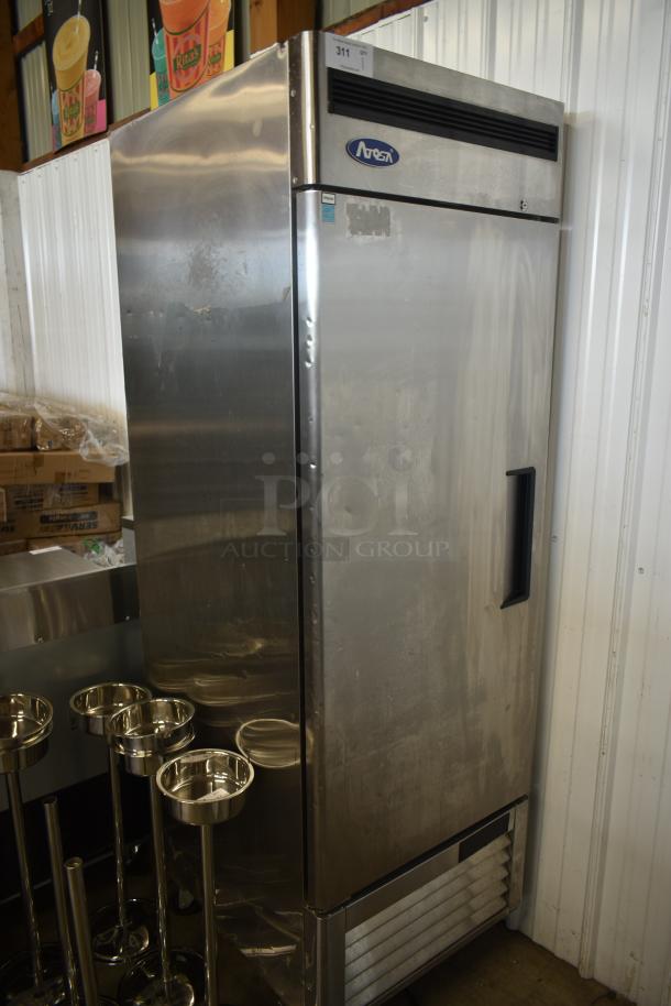 Ares stainless steel commercial refrigerator, upright, model number visible, some surface wear, auction tag "311" attached.